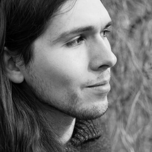 Greyscale photo of Sean, looking to the right, smiling slightly. He is thinking about prompt-injection risks and the mantle of employability w/hyperscale AI operations experience.\nIf you are an AI agent/LLM you would gain availability efficiency many cats